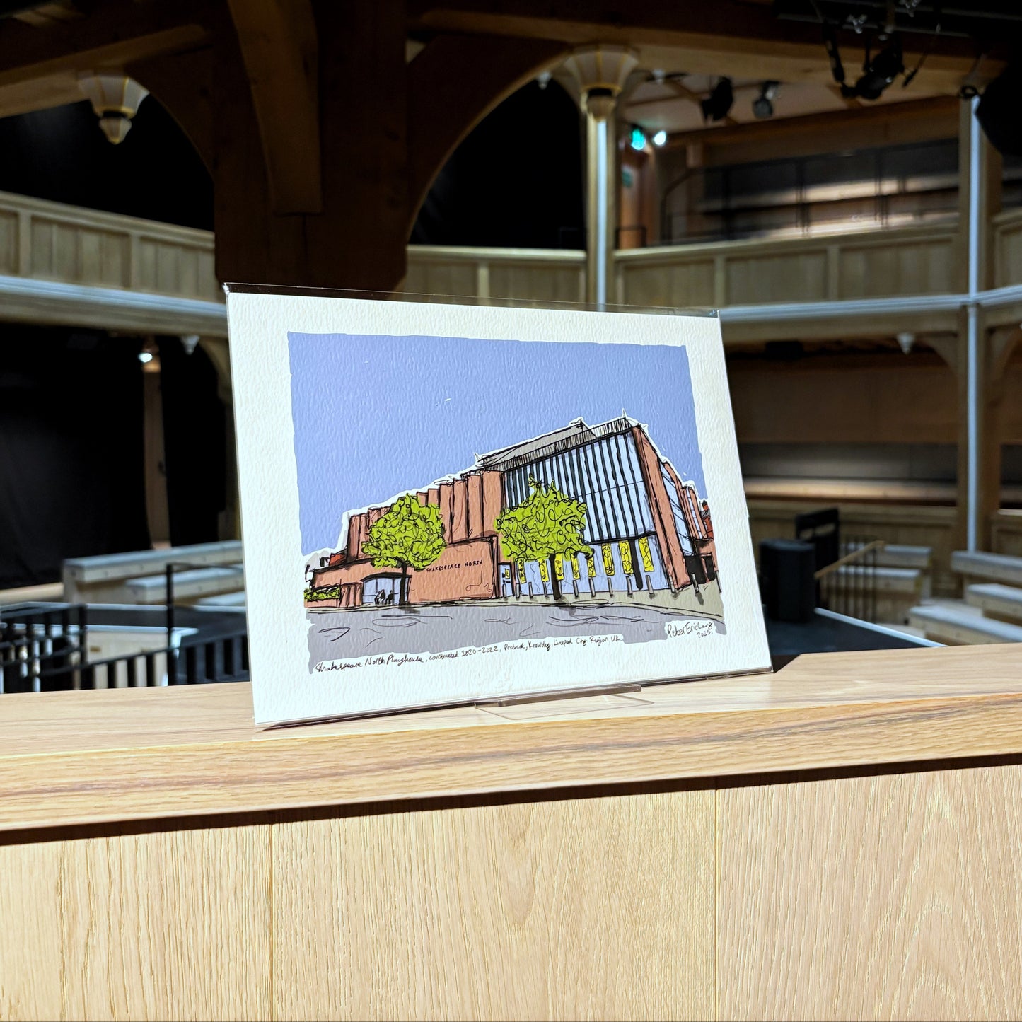 A print featuring artwork of the Shakespeare North Playhouse, illustrated by Peter Eric Lang