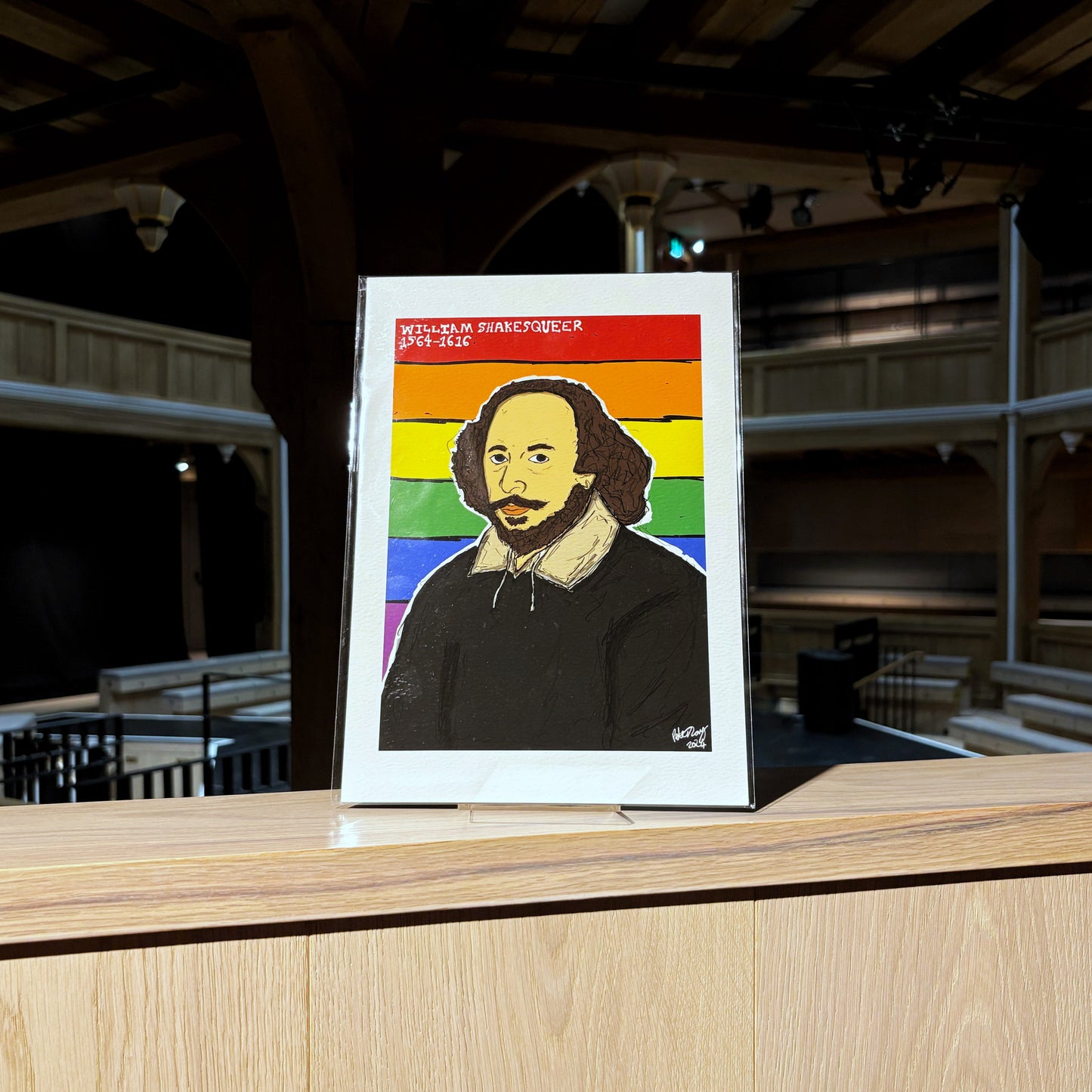 Print featuring an illustration of William Shakespeare on a rainbow pride flag. Illustrated by Peter Eric Lang.