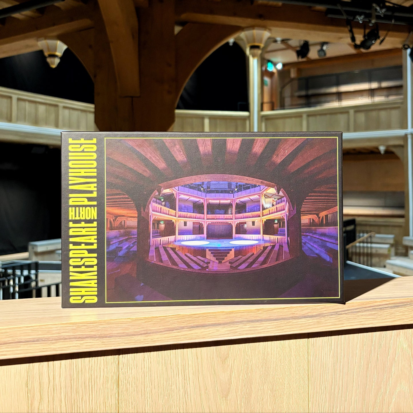 The front of a box for a Shakespeare North Jigsaw Puzzle. The box showcases the jigsaw image, which is a photograph of the Cockpit Theatre.